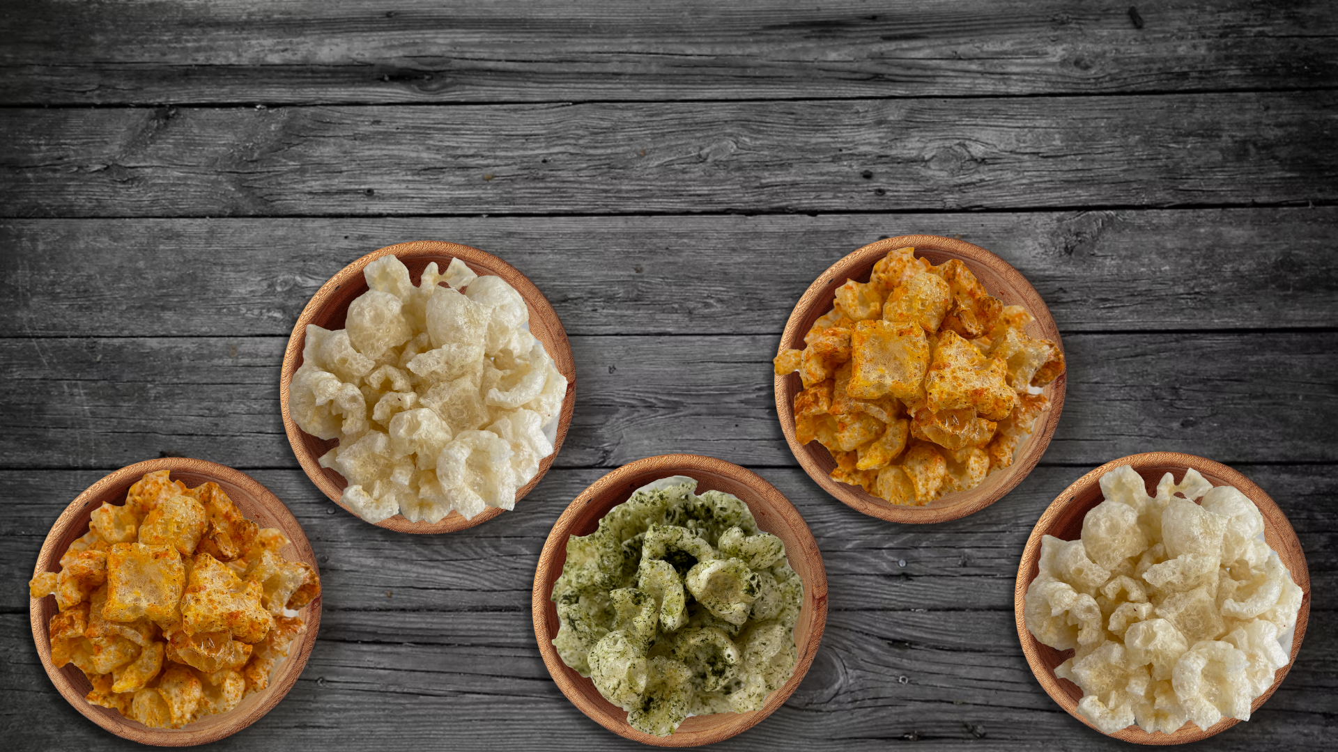 ive bowls of Louis Pasture pork rinds in original, BBQ, jalapeño cheddar, and dill flavours on a rustic wood table