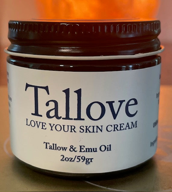 A jar of Tallove skin cream, with the label showing the brand name and the ingredients &